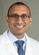 A headshot of Adam Vohra