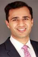 A headshot of Aneel Maini
