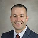 John P. Breinholt