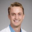 A headshot of David Elison