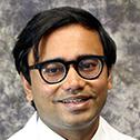 A headshot of Mahesh Naryanan