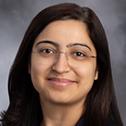A headshot of Nidhi Madan