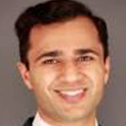 A headshot of Aneel Maini